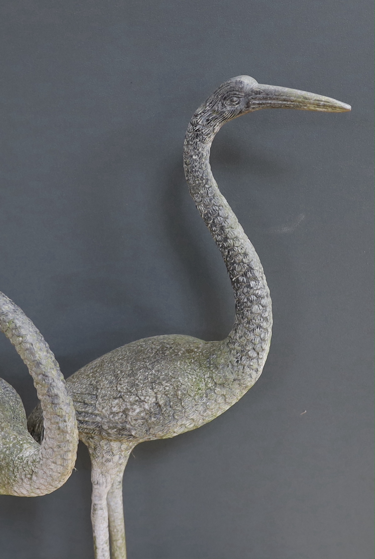 A large pair of weathered metal storks, 95cm